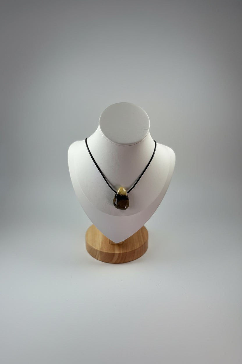 Treasured Energies Septarian crystal pendant necklace on a black cord displayed on a white mannequin bust