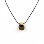 Treasured Energies Septarian crystal pendant necklace featuring a teardrop-shaped stone on a simple black cord
