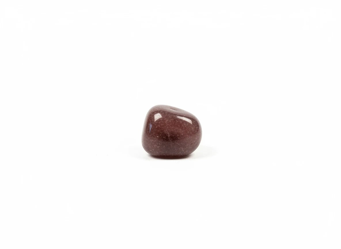 Treasured Energies polished strawberry quartz tumbled stone with a smooth, deep pinkish-red surface on a white background.