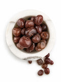 Treasured Energies polished strawberry quartz tumbled stones in a white marble bowl for healing and meditation