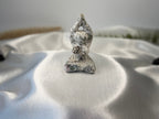 Treasured Energies tree agate yoga woman carving with white and green dendritic patterns on a satin background