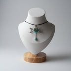 Treasured Energies triple moon goddess pendant necklace featuring a round turquoise stone and a dangling teardrop gem.