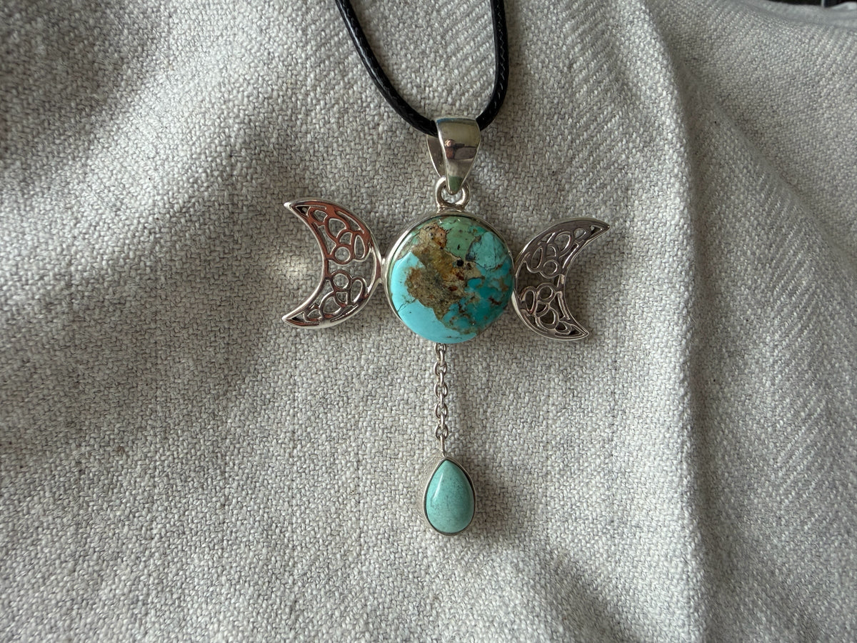 Treasured Energies turquoise triple moon goddess pendant necklace with a teardrop charm on a black cord