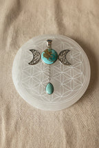 Treasured Energies turquoise triple moon goddess pendant necklace with a teardrop stone on a black cord
