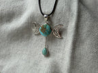 Treasured Energies triple moon goddess pendant necklace featuring a round turquoise stone and a dangling teardrop gem.
