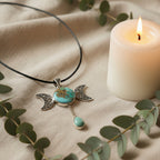 Treasured Energies turquoise triple moon goddess pendant necklace with silver filigree on a black cord
