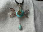 Treasured Energies turquoise Triple Moon Goddess pendant necklace with silver filigree and a dangling teardrop stone.